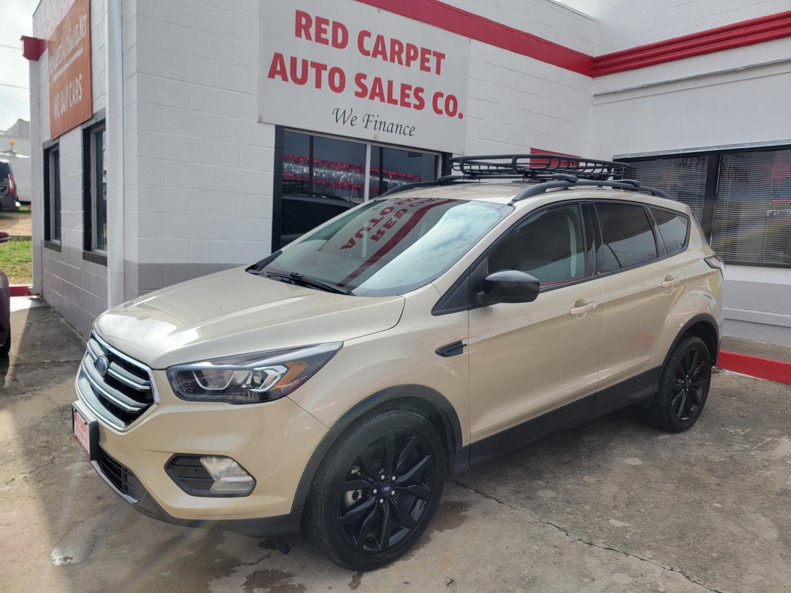 2018 Gold Ford Escape (1FMCU9GD5JU) with an 1.5L I4 F DOHC 16V engine, Automatic transmission, located at 503 West Court, Seguin, TX, 78155, (830) 379-3373, 29.568621, -97.969803 - 2018 Ford Escape SE 4WD with a 1.5L I4 F DOHC 16V, Automatic, Tilt, Cruise, AM/FM/CD Touchscreen Stereo, Power Windows, Locks, Seat and Side Mirrors, Bluetooth, Navigation, Automatic Headlights, Dual Climate Control, Rear A/C, Heated Seats, Tinted Windows, Luggage Rack, Backup Camera, Bumper Sensors - Photo #0